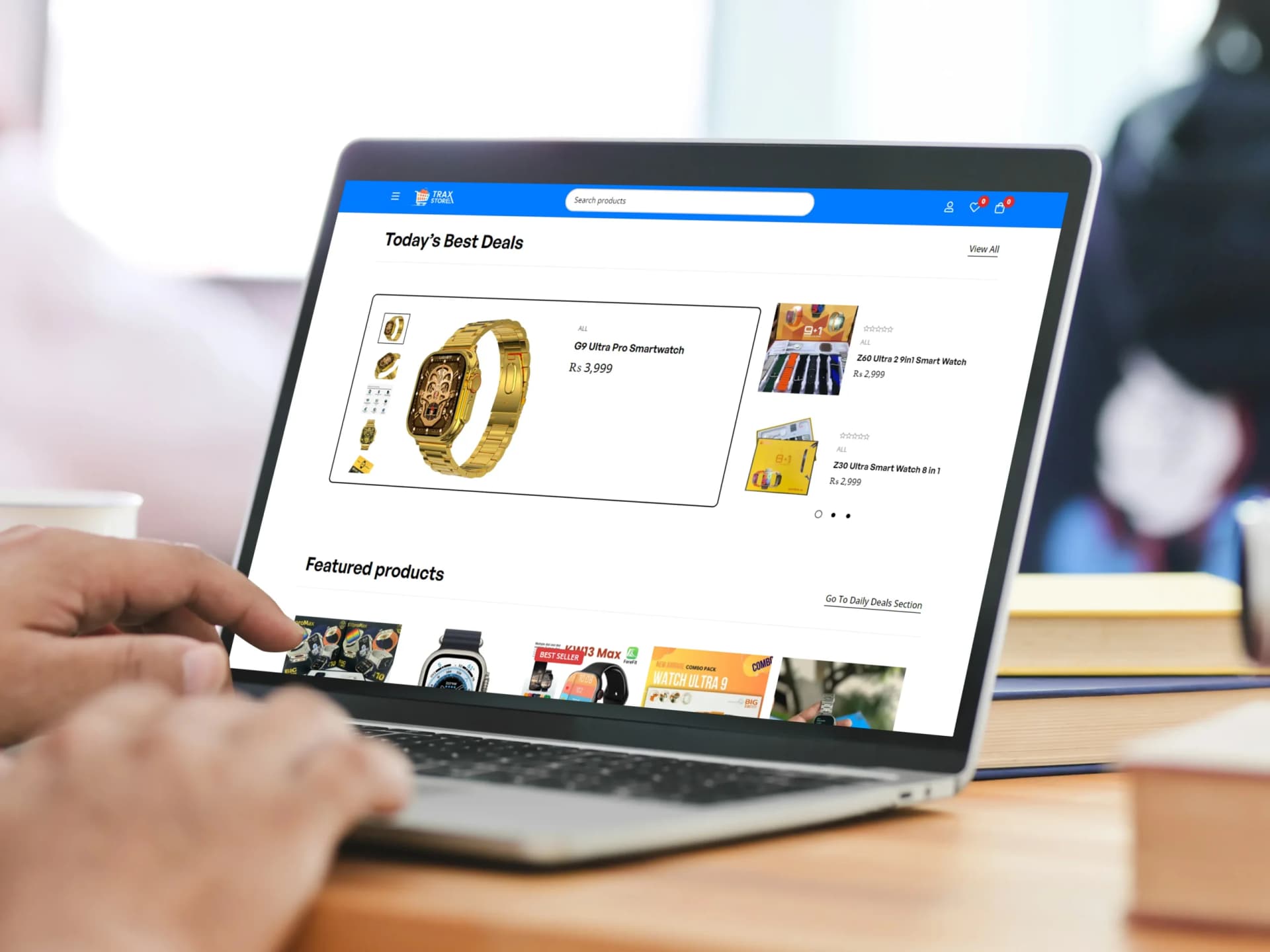 Trax Store e-commerce website displayed on a laptop